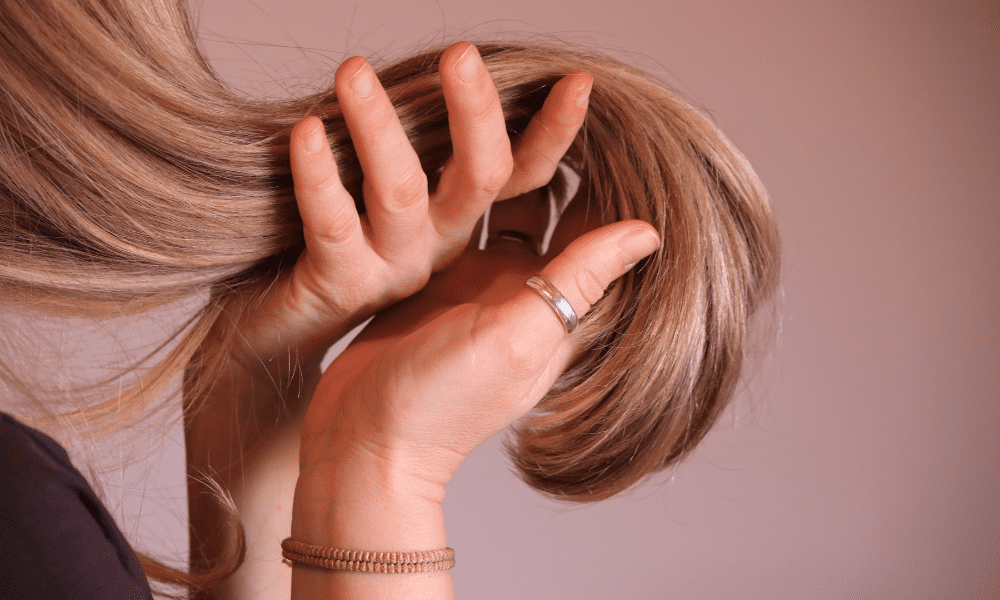 young woman touching her hair