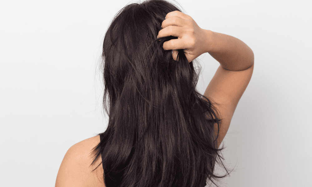 woman with healthy black hair, back turned