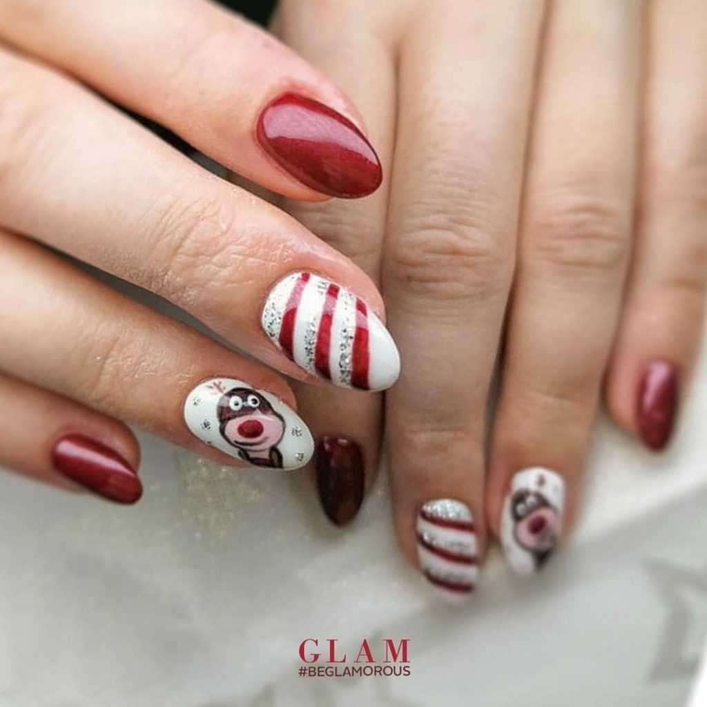 This cartoon-themed nail art design for Christmas