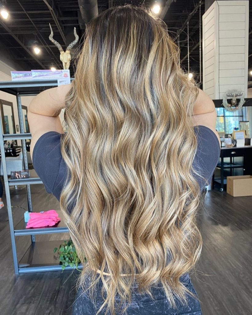A lighter brown shade with blonde highlights will be great