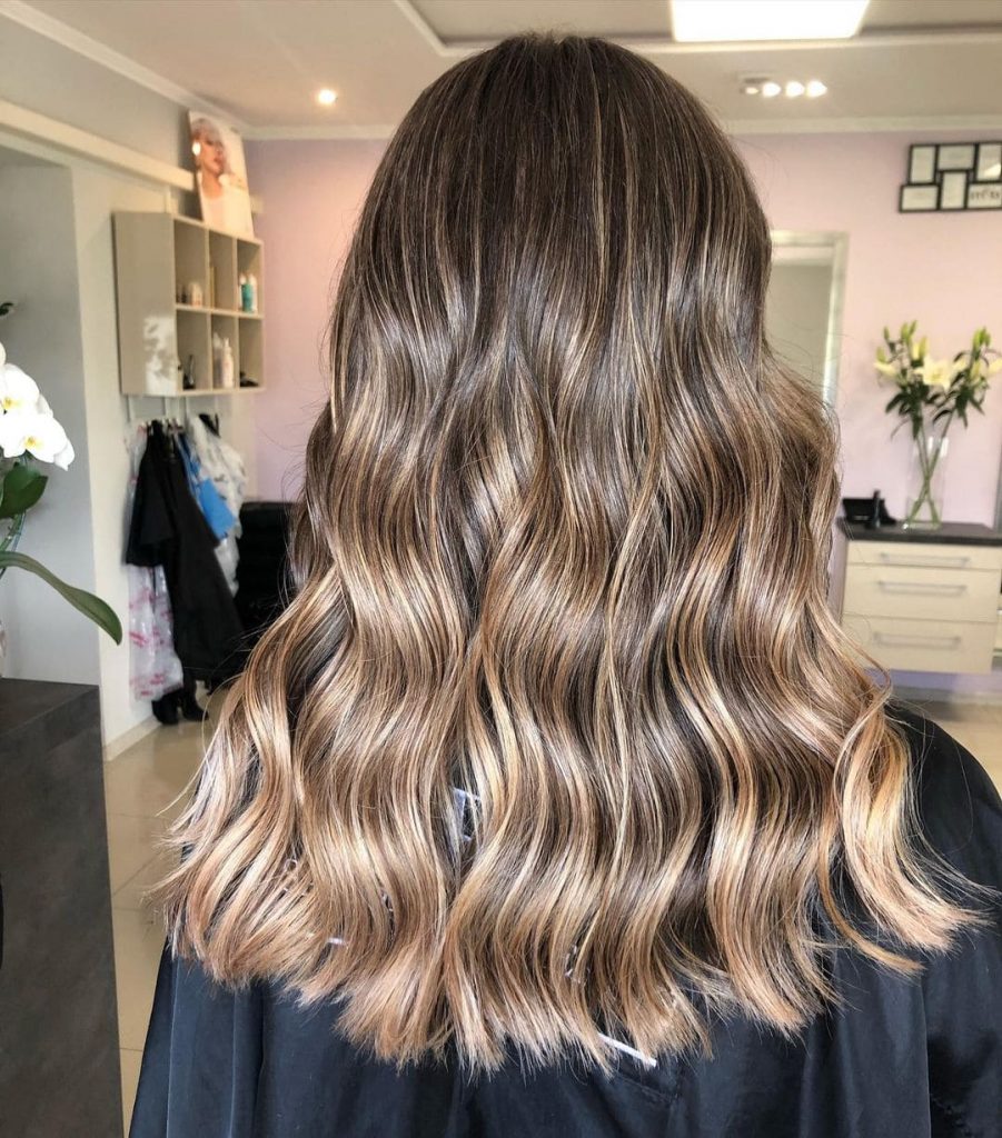 If you rock dark long brown hair, different shades of brown and blonde highlights will get you the perfect hairdo