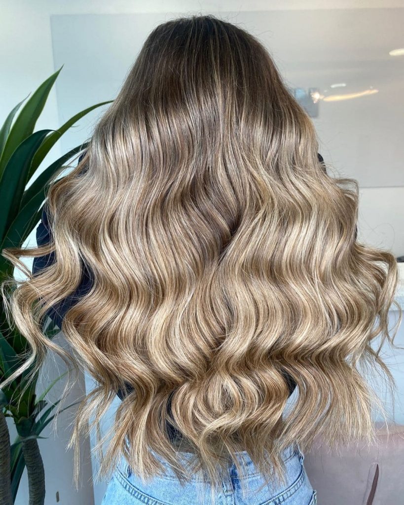 Giving your brown hair a complete blonde look will keep the brown hue far away