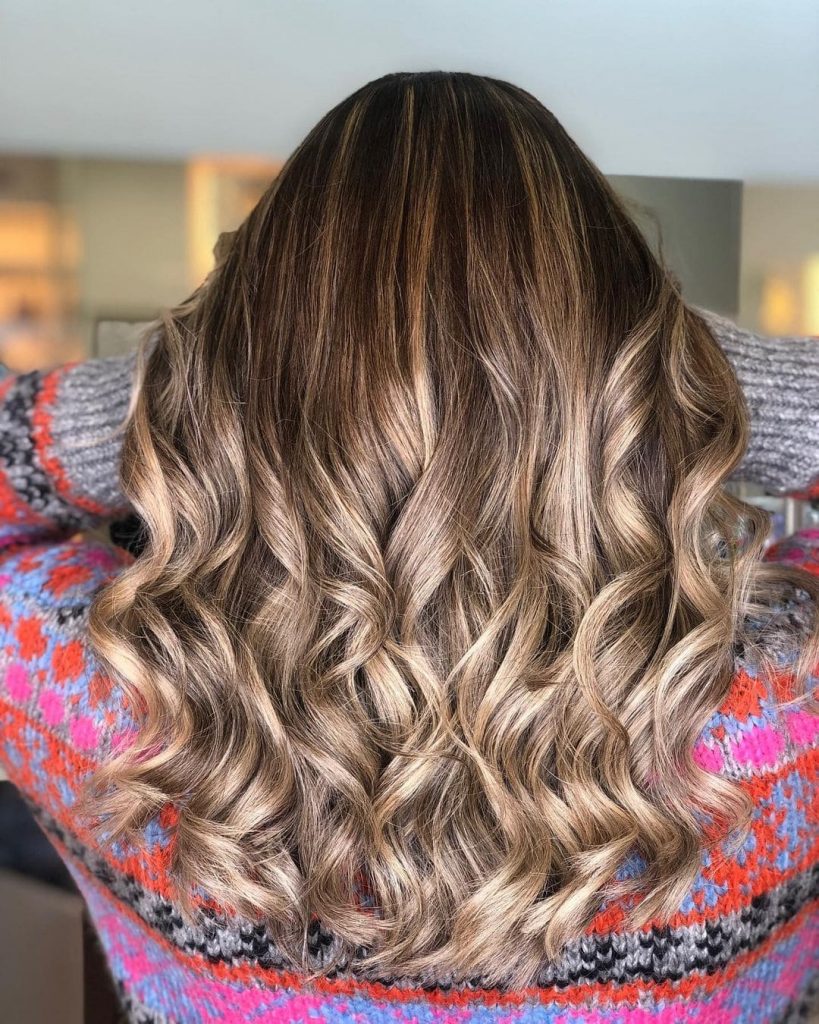 The blend of brown hair with a few touches of blonde highlights will never disappoint