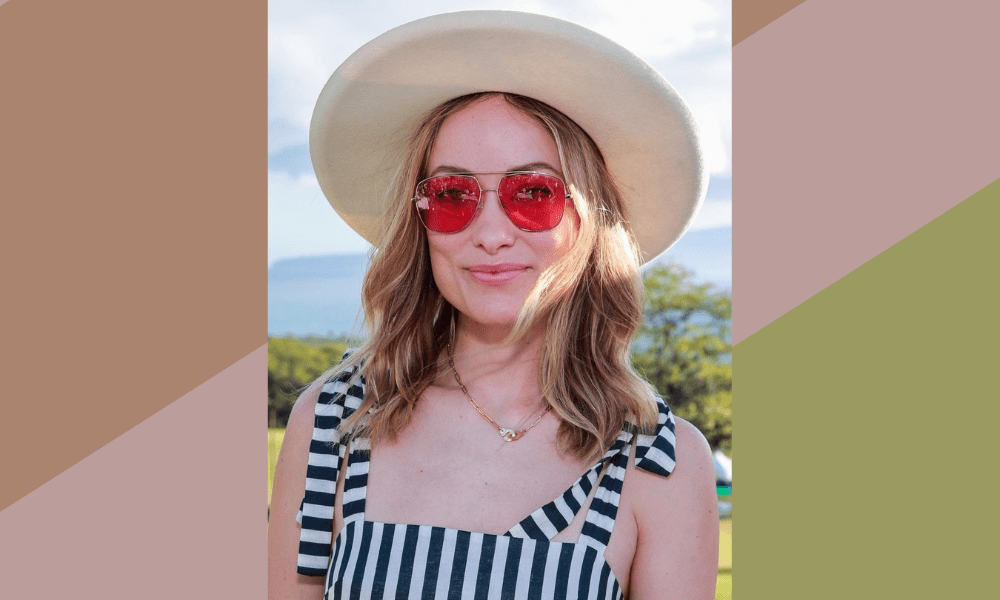 olivia wilde with a red sunglasses and a hat